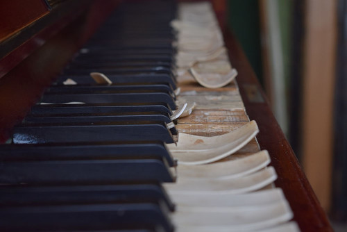 Image of a damaged piano, an example of personal property that ICON Restoration may be able to help restore.